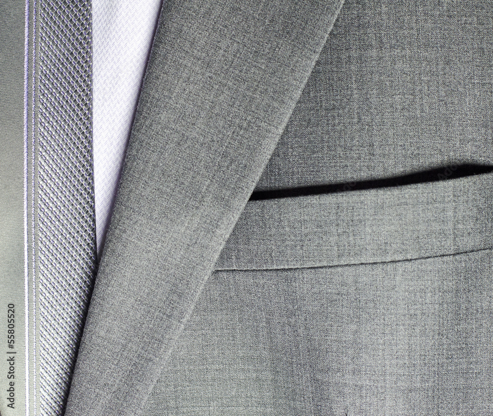 detail of a grey man suit with tie detail of a grey man suit with tie