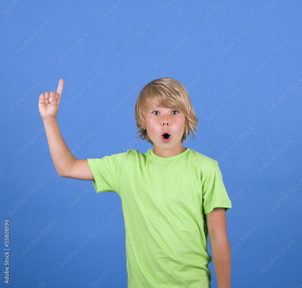 schoolboy raising his hand to give an answer schoolboy raising his hand to give an answer