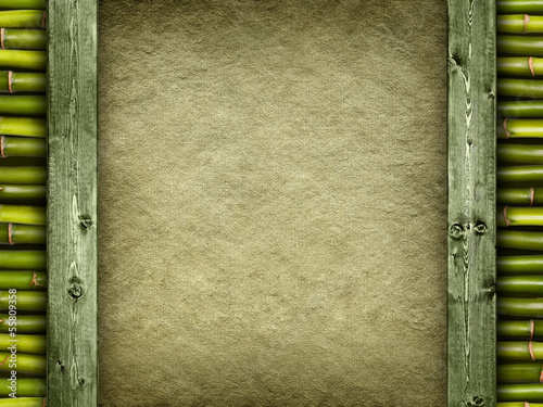Canvas sheet and green planks on bamboo background
