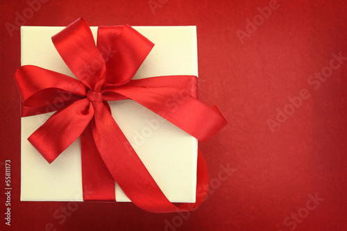 Close up of gift box on red background