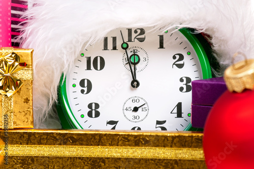 Alarm clock with santa hat photo