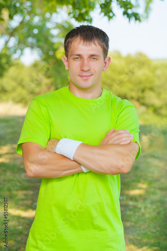 a men wearing in green t-shirt