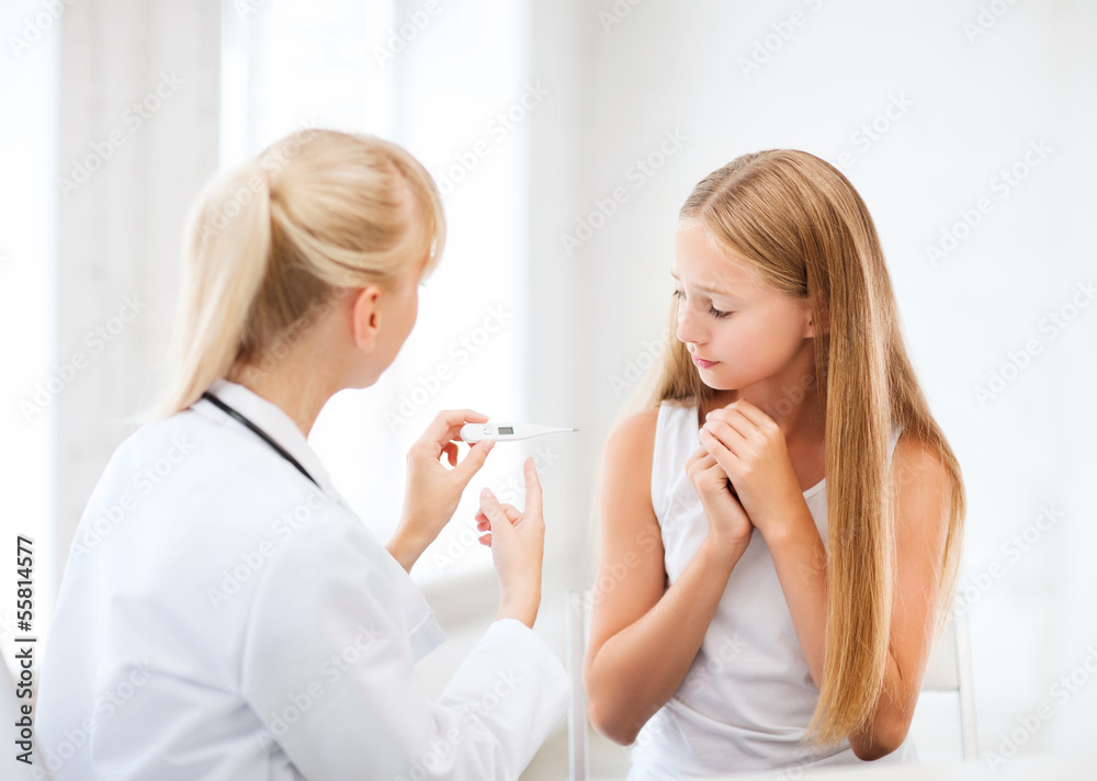 doctor with child measuring temperature