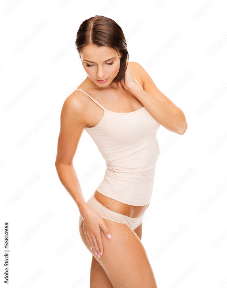 woman in cotton underwear showing slimming concept woman in cotton underwear showing slimming concept