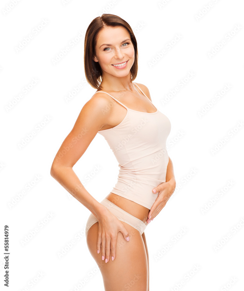 woman in cotton underwear showing slimming concept woman in cotton underwear showing slimming concept