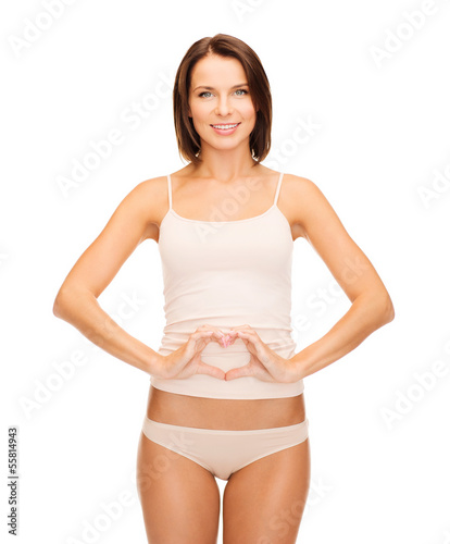 woman forming heart shape