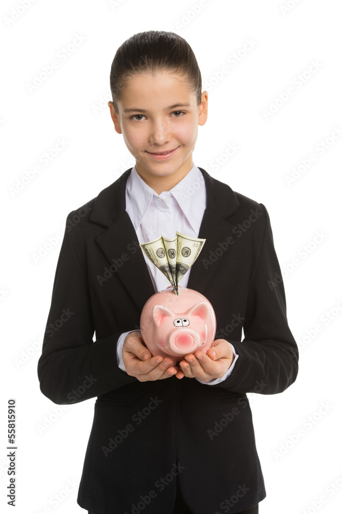 Little girl with piggy bank. Cheerful little girl in formalwear Little girl with piggy bank. Cheerful little girl in formalwear
