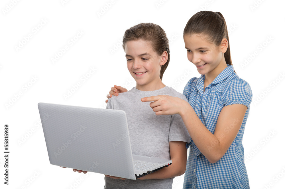 Kids with laptop. Cheerful little kids in holding laptop and smi