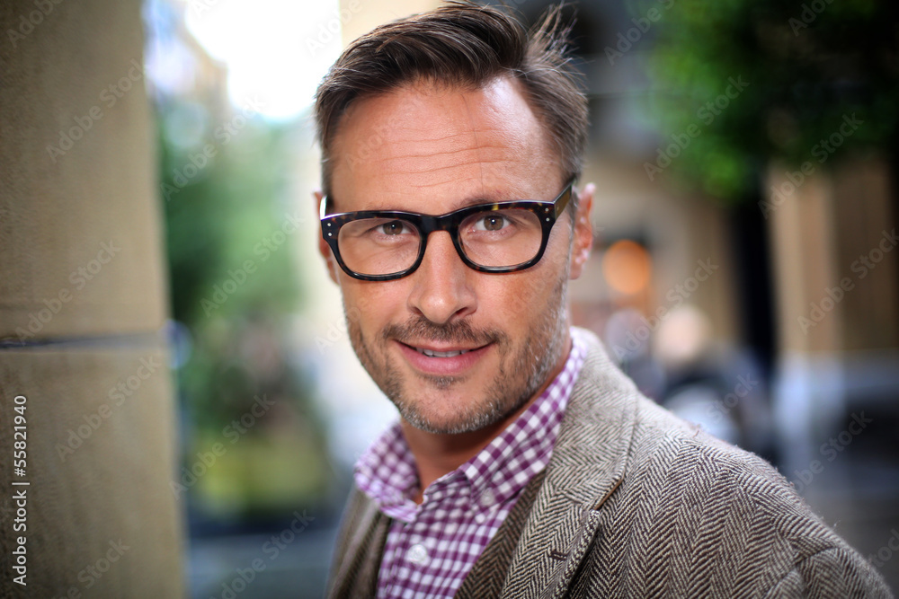 Trendy handsome man with eyeglasses in the street