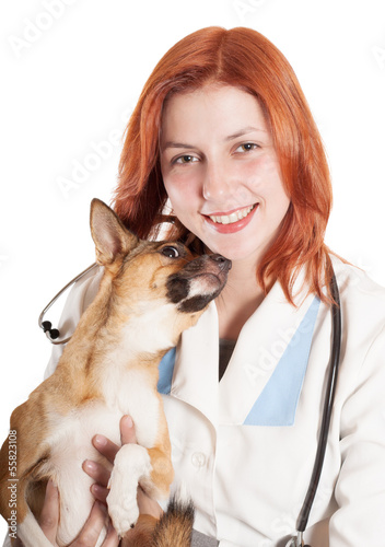 veterinarian with a dog in her arms