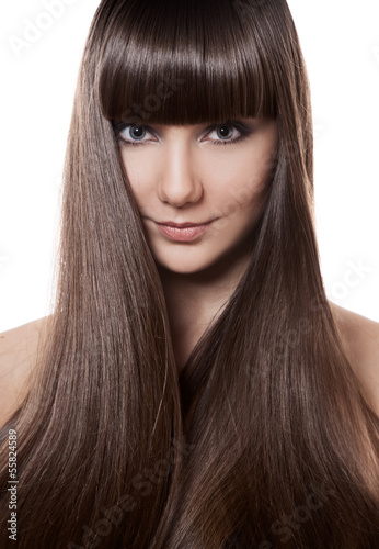 Portrait of a beautiful brunette woman with long straight hair