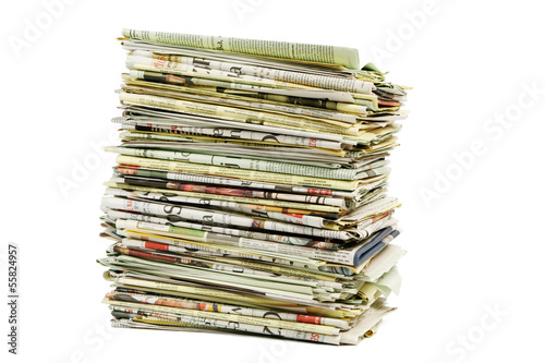 Stack of newspapers on white background