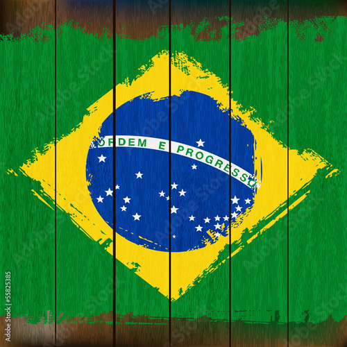 Grunged Brazilian Flag over a wooden plank  background