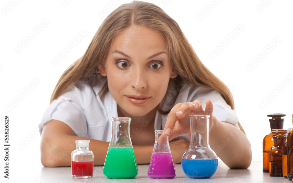 Woman chemist and chemicals in flasks Woman chemist and chemicals in flasks