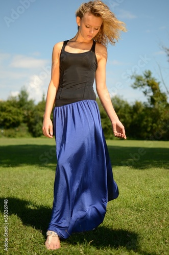 Blond female model in blue dress