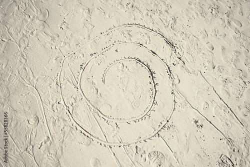 drawn in the sand of a beach.