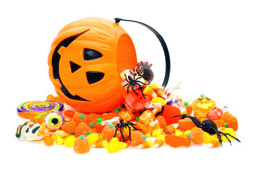 Halloween candy spilling from a Jack o Lantern holder