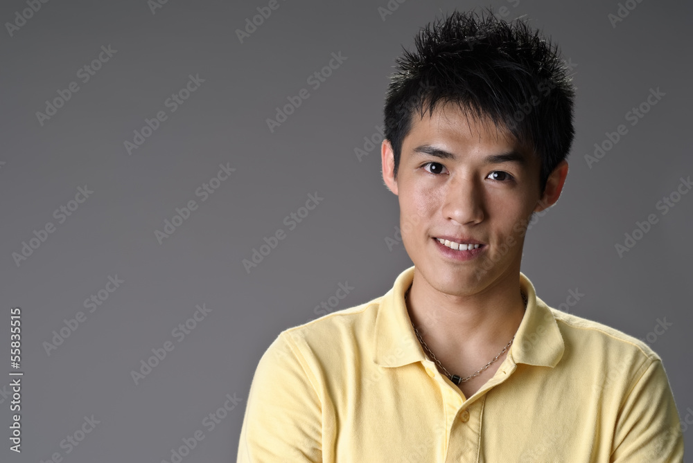 Obraz premium Happy smiling young man