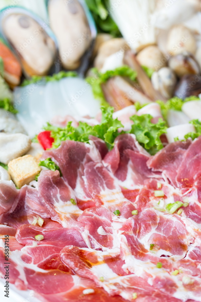 freshness slices pork and sea food on white dish freshness slices pork and sea food on white dish