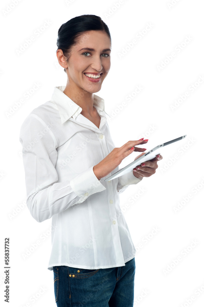 Woman browsing on new touch pad device Woman browsing on new touch pad device