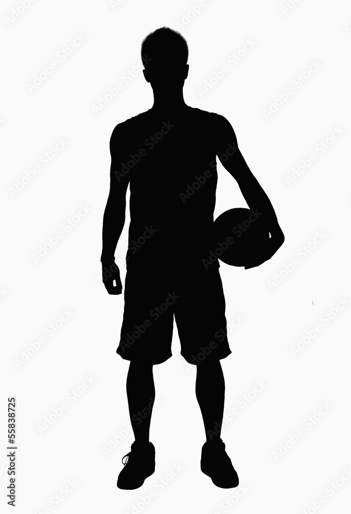 Silhouette of basketball player holding ball.