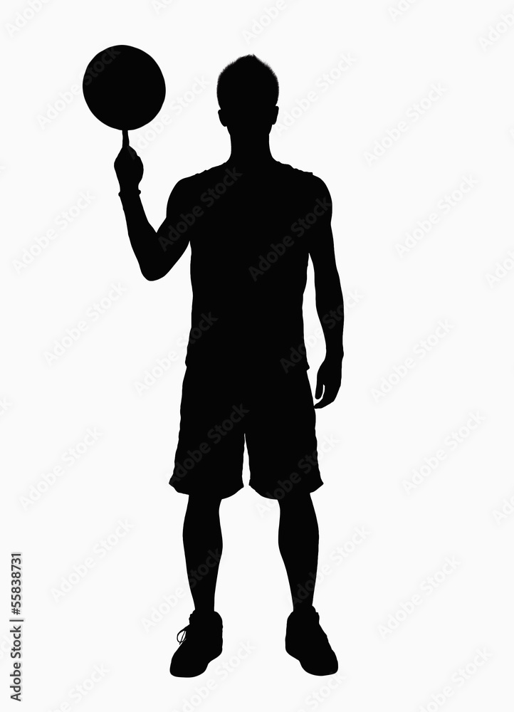 Silhouette of basketball player spinning basketball on finger. Stock Photo  | Adobe Stock
