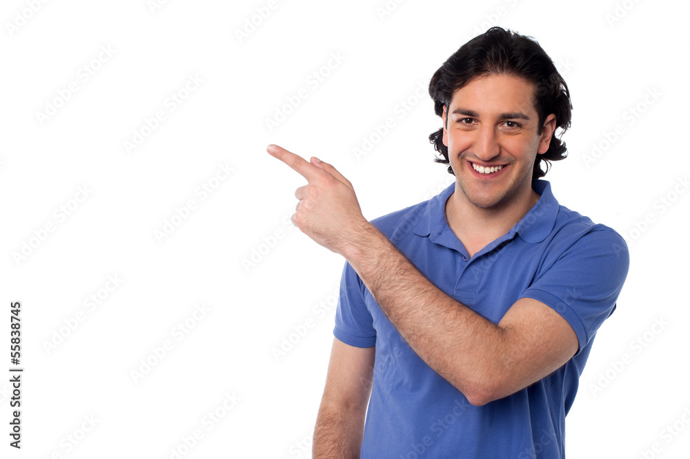Handsome man pointing at something Handsome man pointing at something