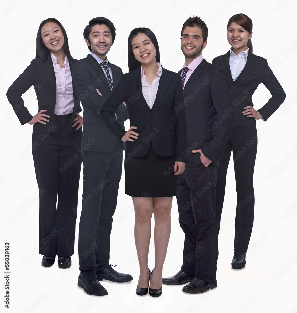 Portrait of five young smiling businesswomen and young businessmen, looking at camera, studio shot Portrait of five young smiling businesswomen and young businessmen, looking at camera, studio shot