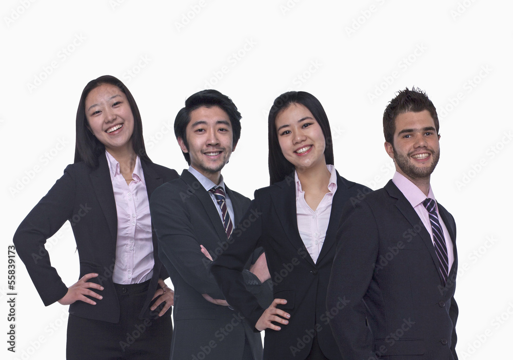 Portrait of four young business people looking at the camera, three quarter length, studio shot Portrait of four young business people looking at the camera, three quarter length, studio shot