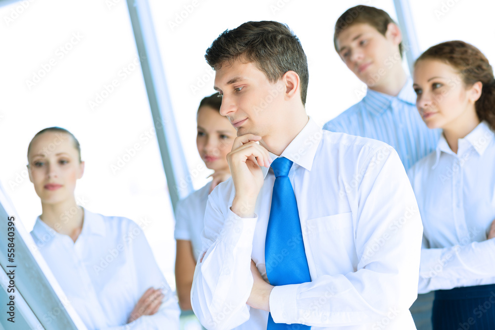 businessmen are meeting near the flipchart businessmen are meeting near the flipchart