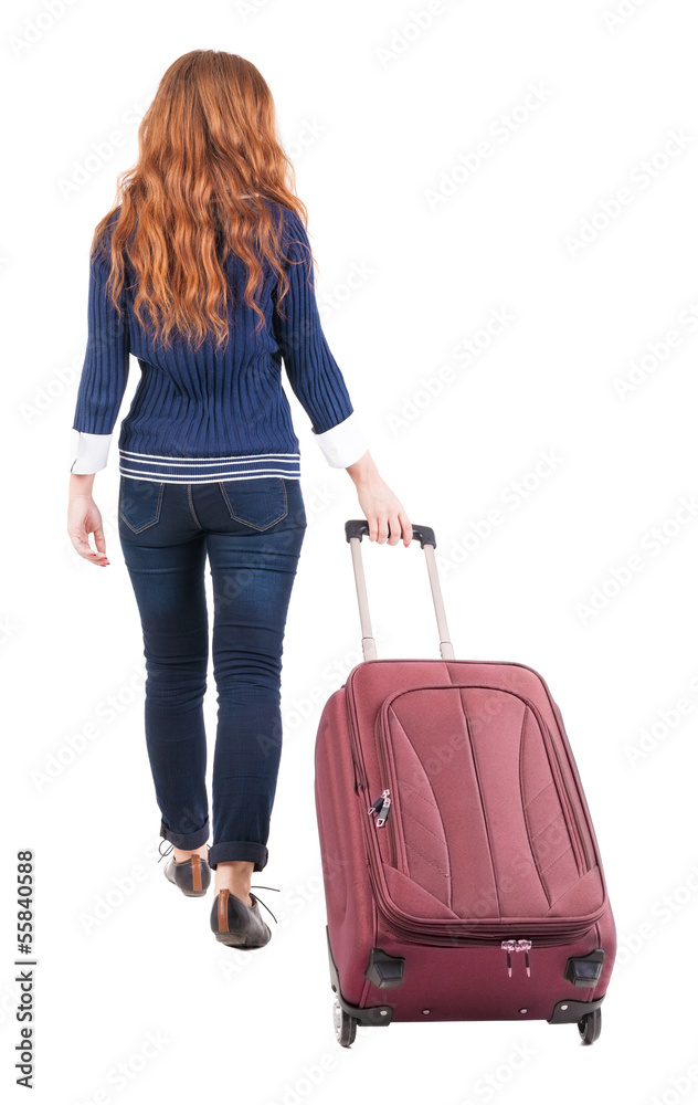 back view of walking woman with suitcase back view of walking woman with suitcase