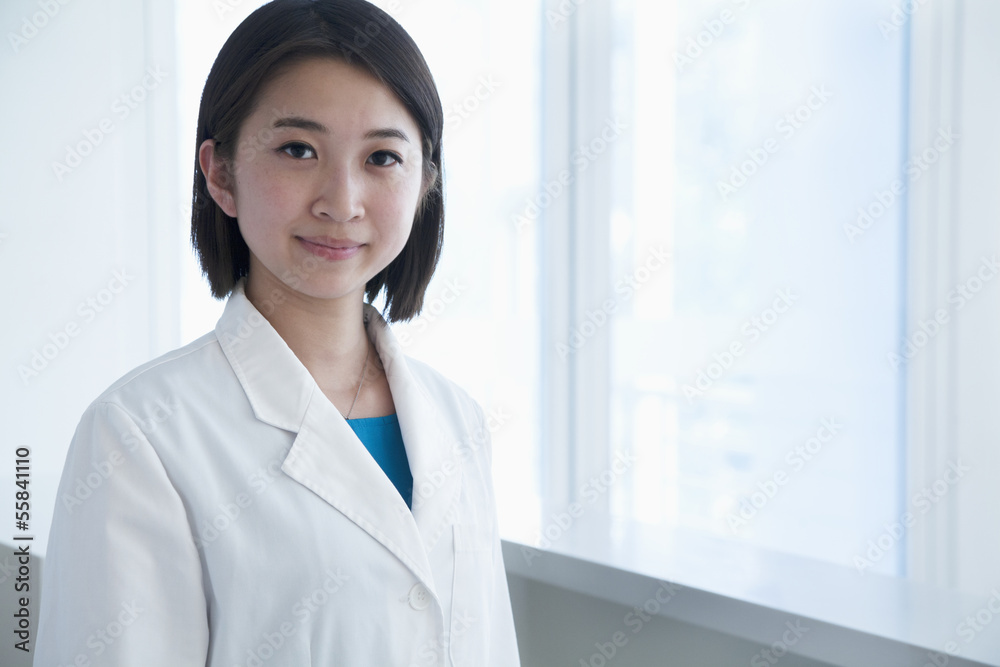 Portrait of young female doctor in the hospital, looking at camera Portrait of young female doctor in the hospital, looking at camera