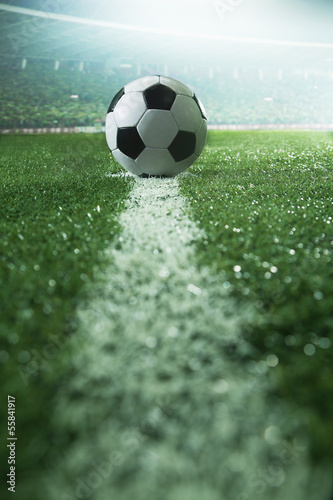 Fototapeta Naklejka Na Ścianę i Meble -  Soccer field with soccer ball and line, side view