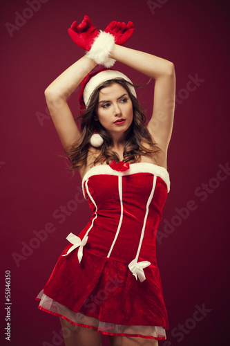 Sexy woman wearing santa claus clothes