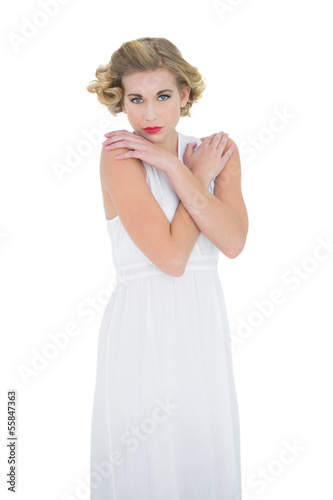 Gorgeous fashion blonde model posing with hands on shoulders © lightwavemedia