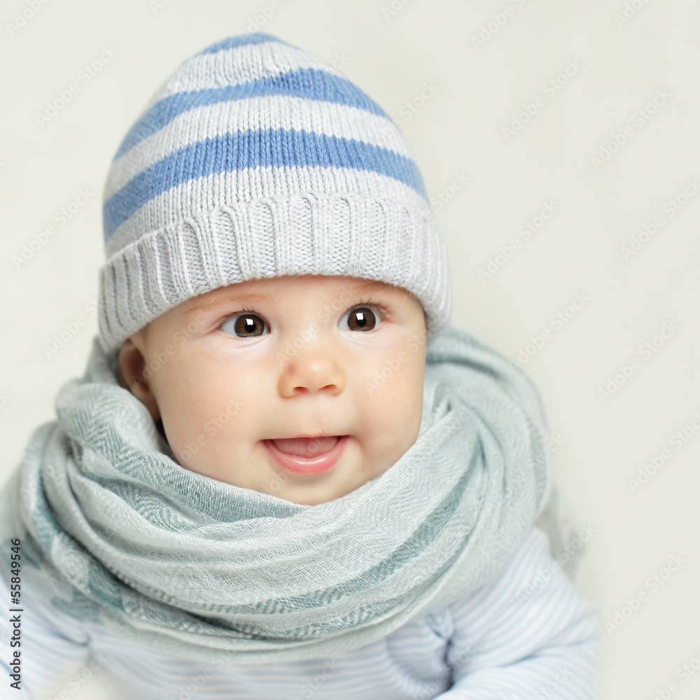 Laughing baby - adorable face, child in blue Laughing baby - adorable face, child in blue