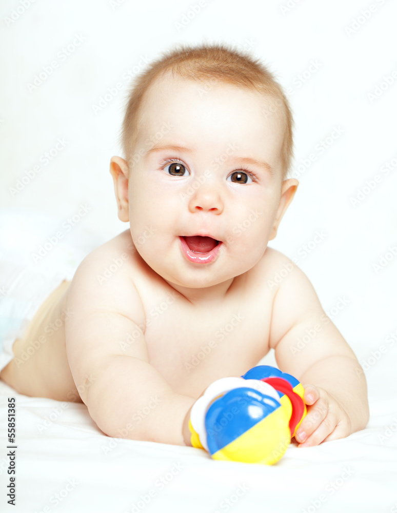 Happy child playing with ratte - baby, 5 months old Happy child playing with ratte - baby, 5 months old