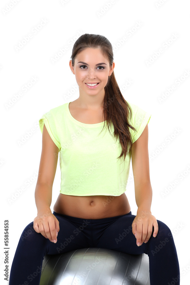 Beautiful young girl doing exercises isolated on white Beautiful young girl doing exercises isolated on white