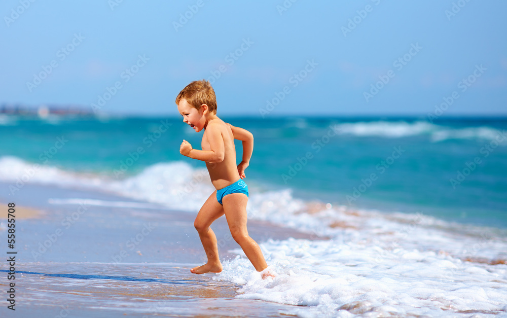 cute kid boy having fun in sea surf cute kid boy having fun in sea surf