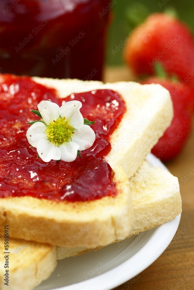 Close-up of toast with strawberry jam on plate Close-up of toast with strawberry jam on plate