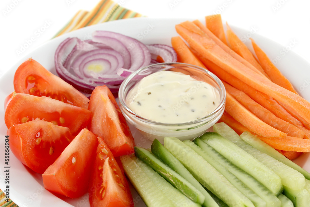 Assorted raw vegetables sticks in plate close up