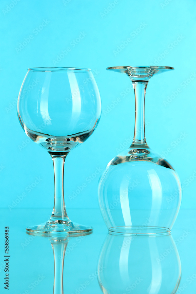 Two glasses on light blue background Two glasses on light blue background