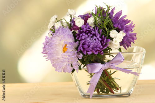 Fototapeta Naklejka Na Ścianę i Meble -  Beautiful bouquet of bright flowers in glass vase,