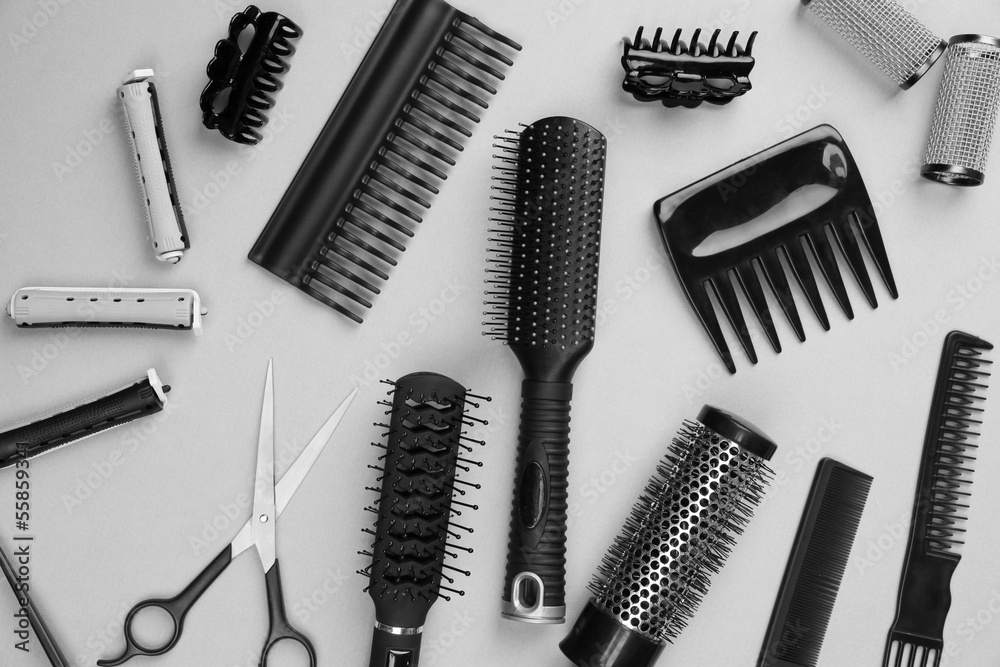 Professional hairdresser tools on gray background Professional hairdresser tools on gray background