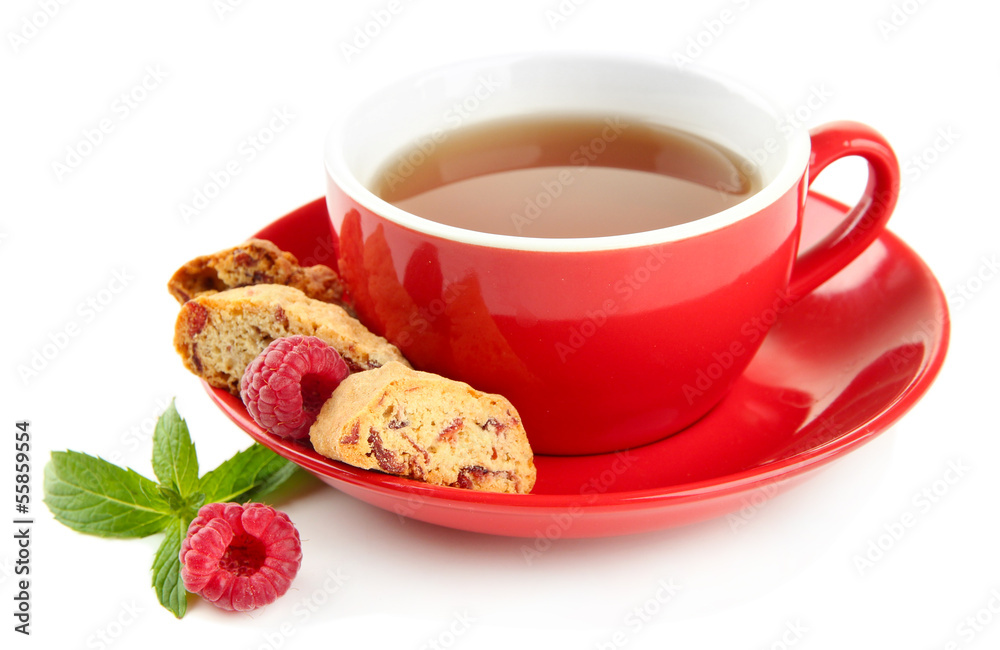 Cup of tea with cookies and raspberries isolated on white Cup of tea with cookies and raspberries isolated on white