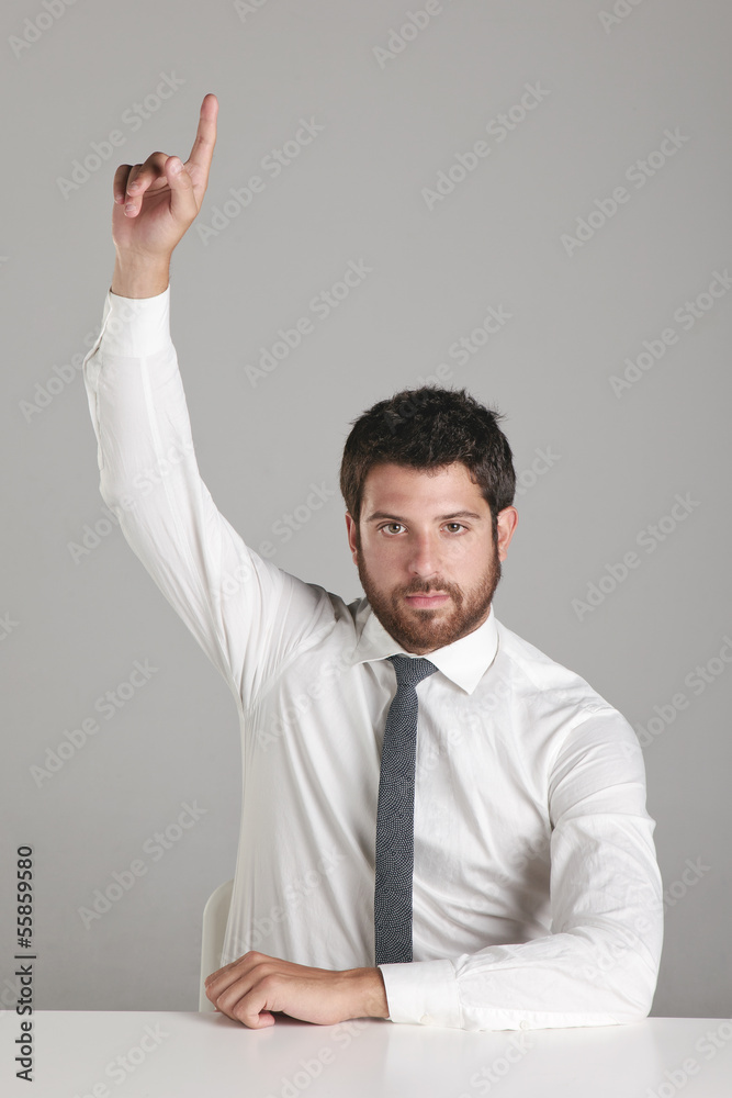 Portrait of a young businessman lifting the hand. Portrait of a young businessman lifting the hand.