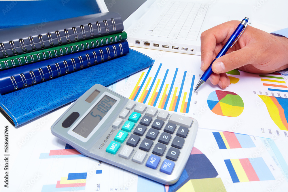 Obraz premium Hand with calculator.