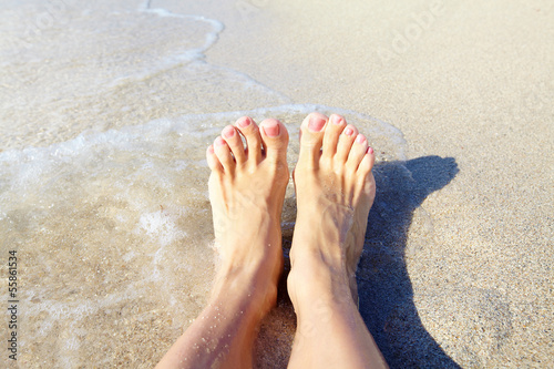 Legs on the beach.