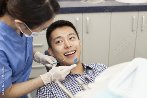 Photography Male Patient Receiving Treatment In Clinic