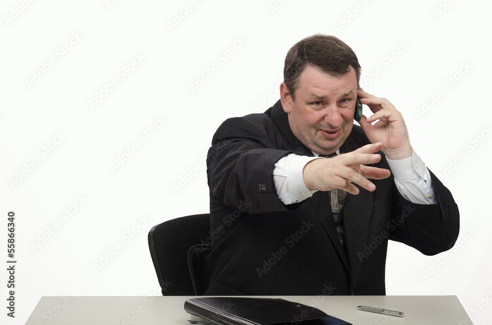 Quinquagenarian businessman speaking on the phone Quinquagenarian businessman speaking on the phone